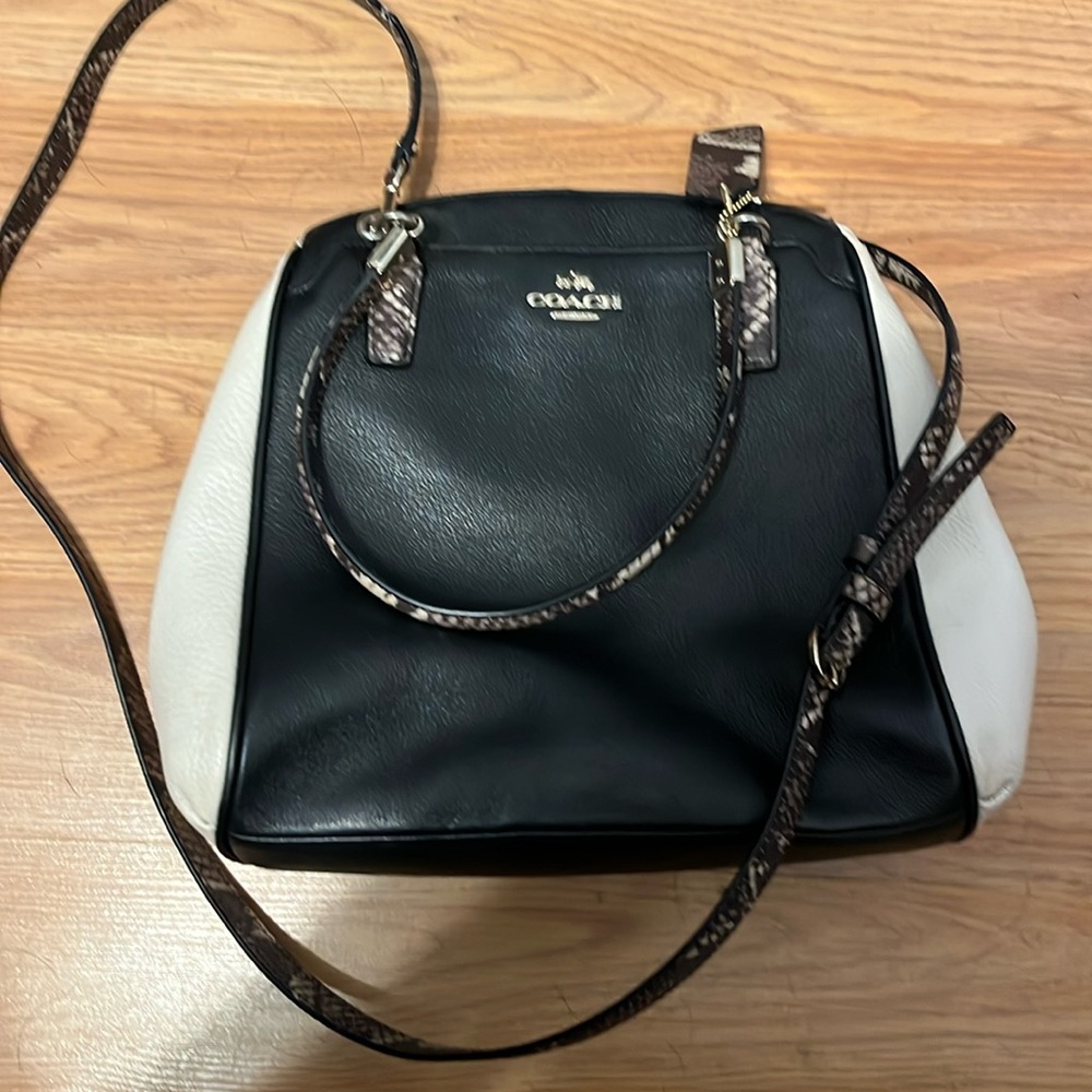 Black and white Coach bag with snakeskin accents